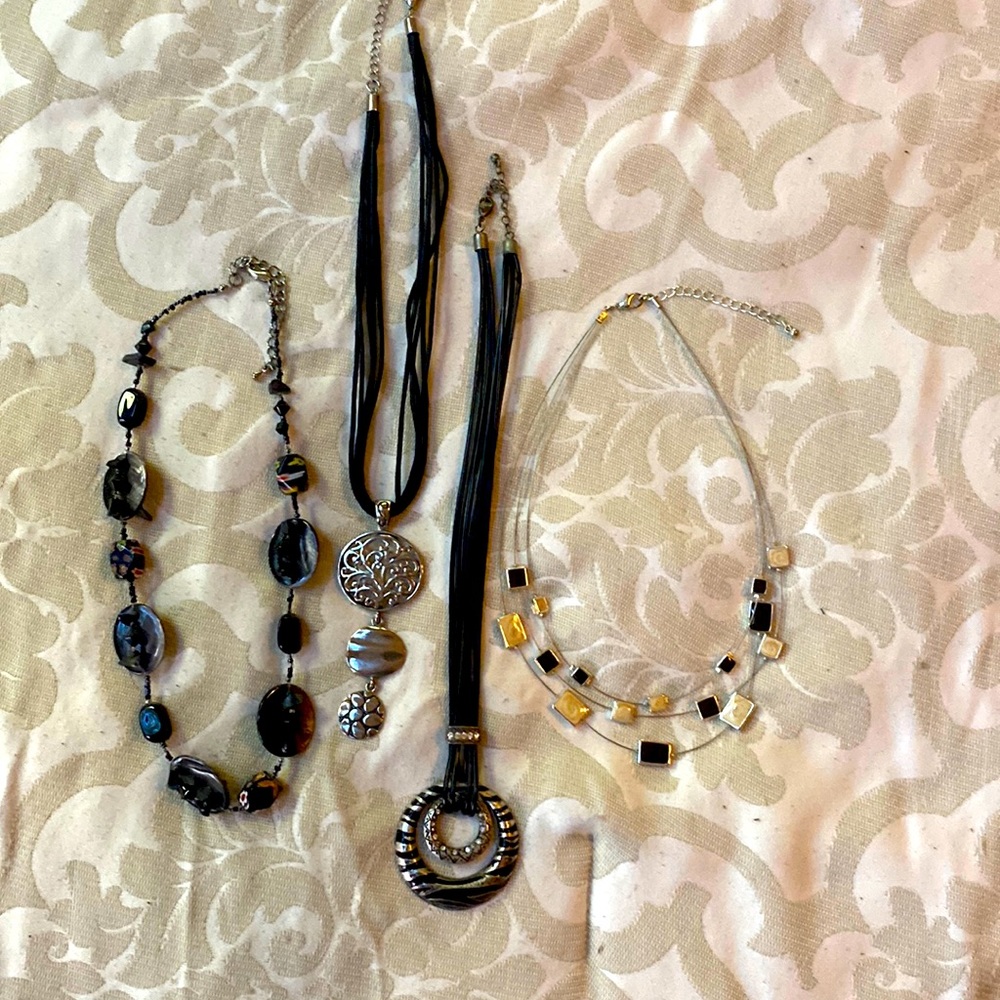 4 black and silver necklaces